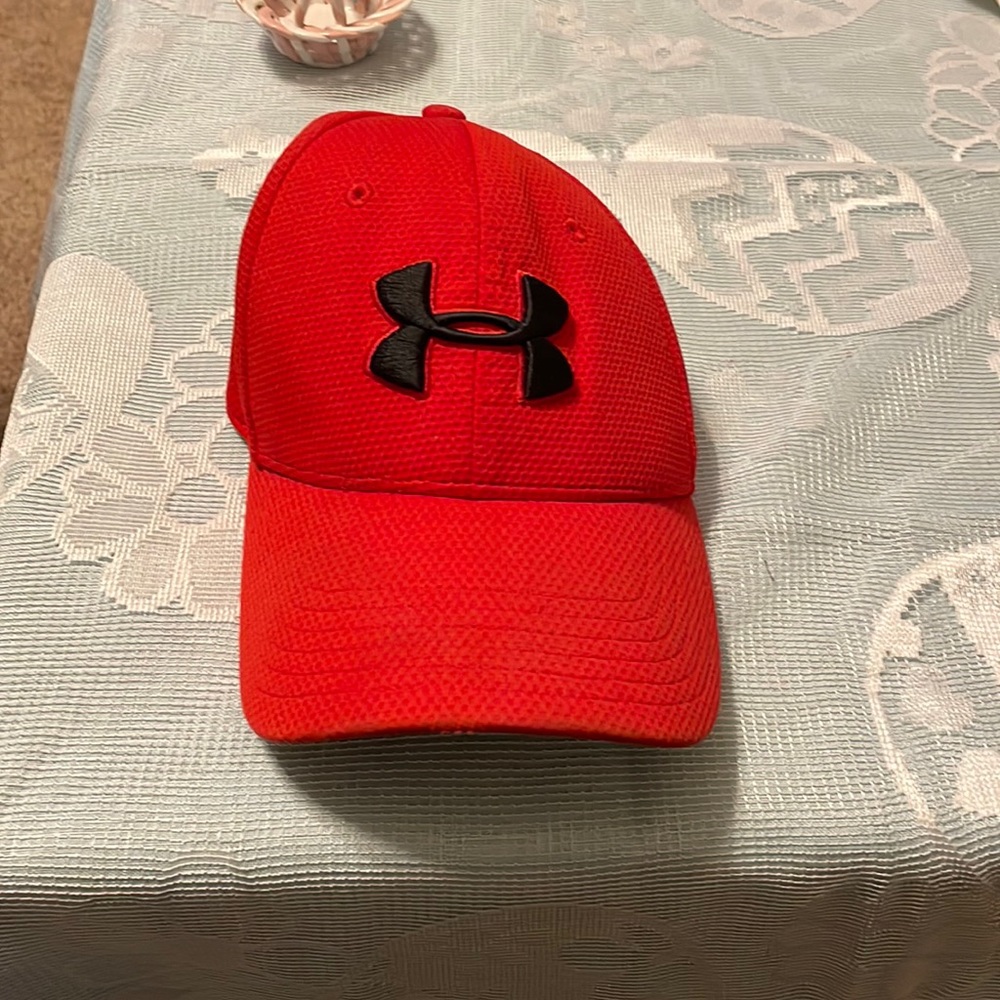 New red mens under armour hat with under armour logo on front and back